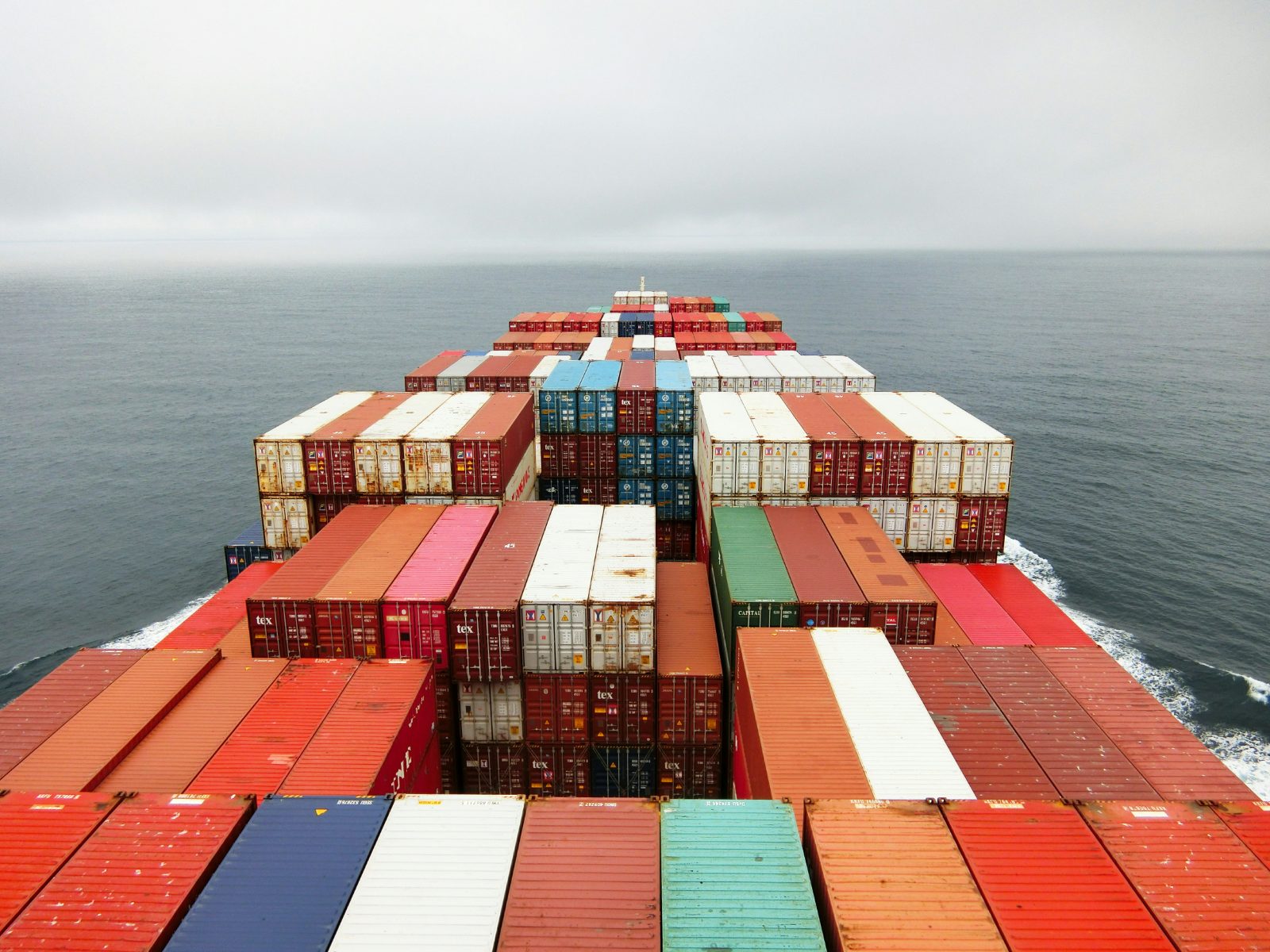 View over container stacks from the bridge of a vessel at sea