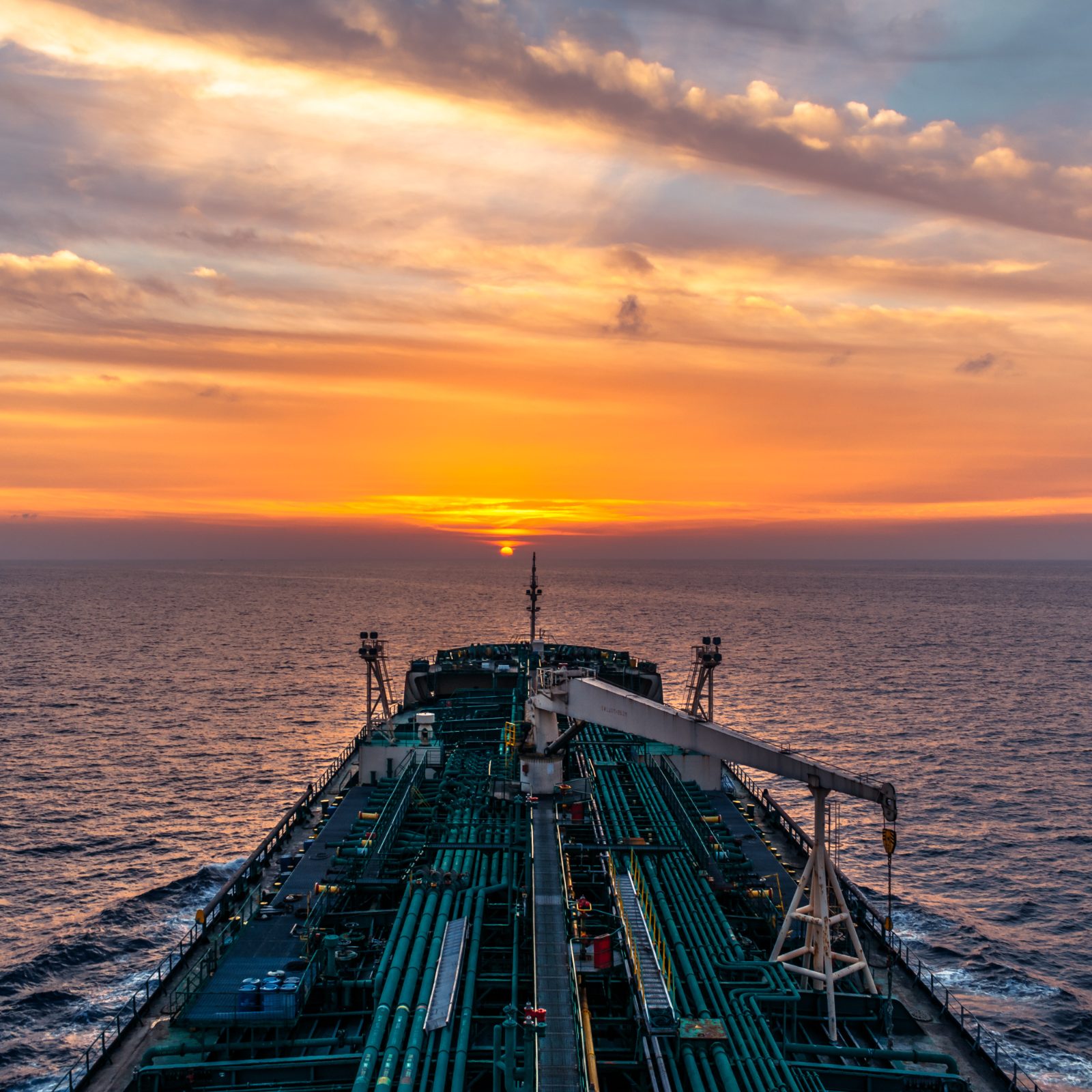 Tanker at sea at sunset